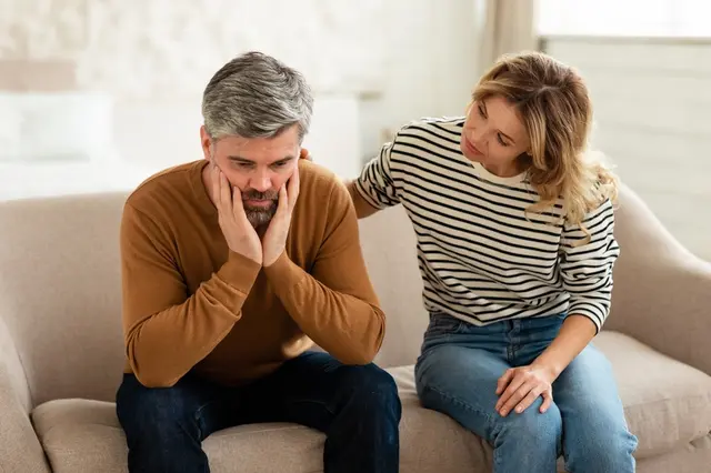Middle-aged man distressed by woman
