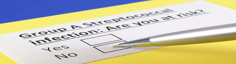 Dotazník o riziku infekce streptokokem skupiny A s tužkou.
