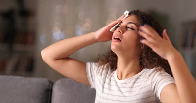 Woman with headache symptoms